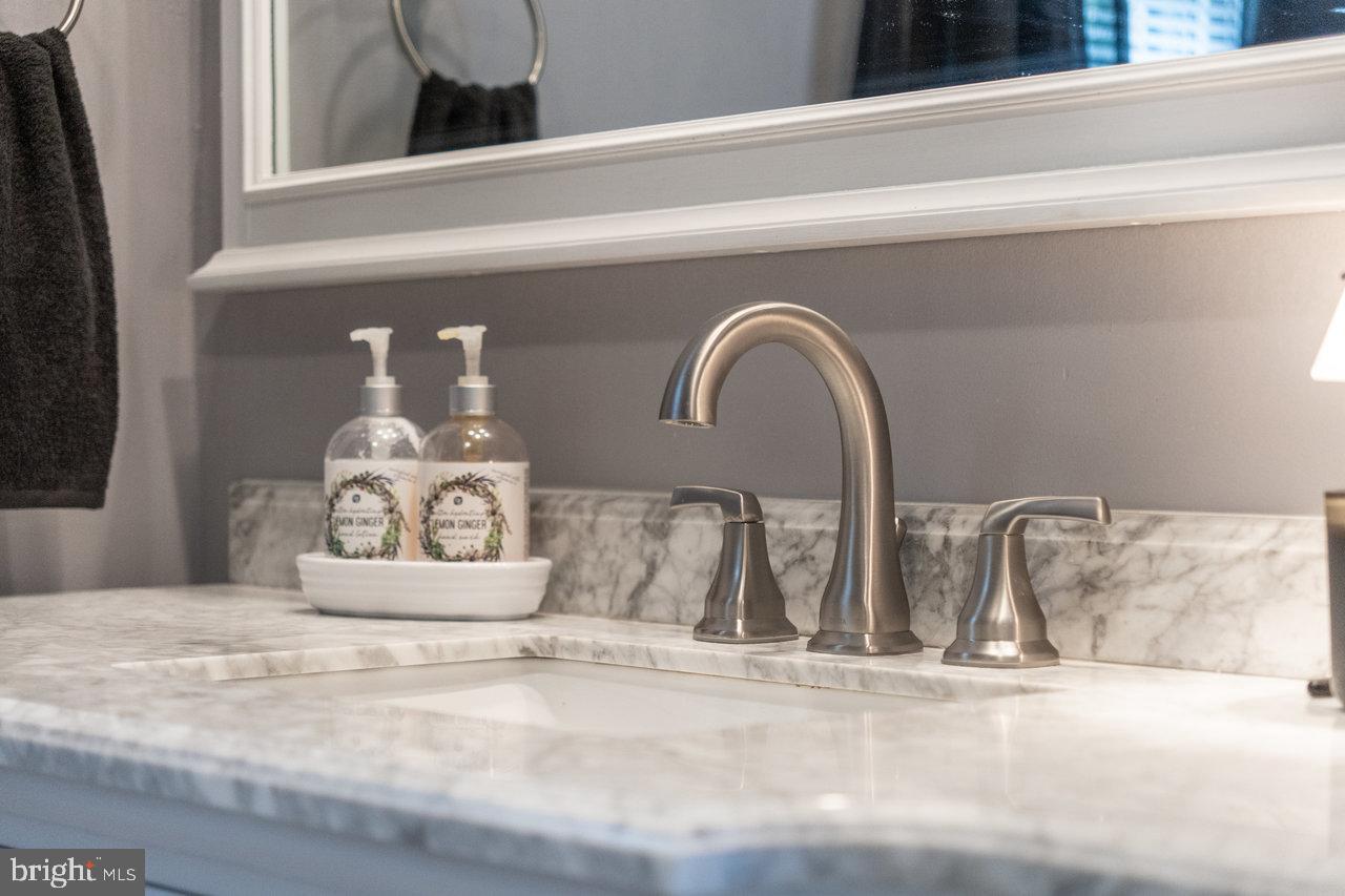 120 Galen Hedrick Road Franklin, WV 26807 - Photo 61 of 115 Sleek marble vanity with modern fixtures.