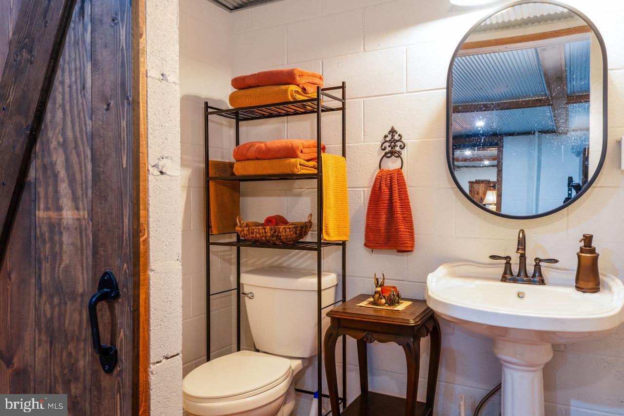 120 Galen Hedrick Road Franklin, WV 26807 - Photo 66 of 115 a bathroom with a toilet sink and mirror