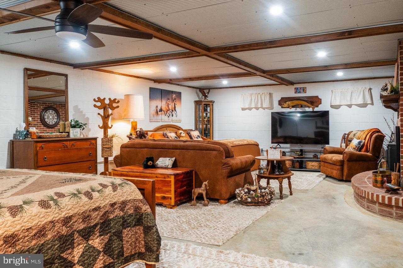 120 Galen Hedrick Road Franklin, WV 26807 - Photo 71 of 115 a bedroom with furniture and a lamp