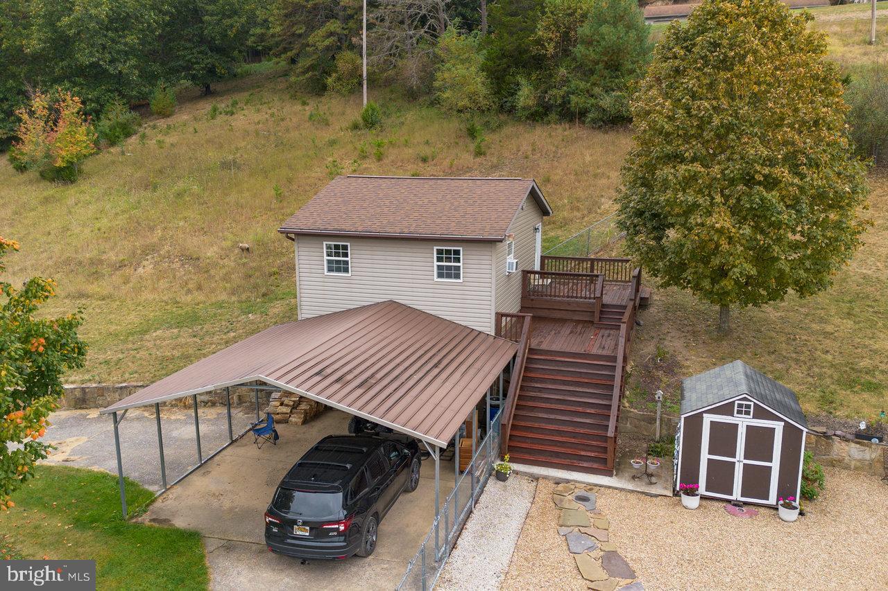 120 Galen Hedrick Road Franklin, WV 26807 - Photo 76 of 115 a view of a roof deck with table and chairs with wooden floor and fence