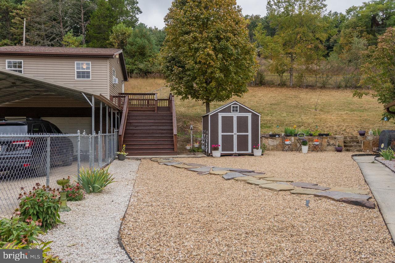 120 Galen Hedrick Road Franklin, WV 26807 - Photo 86 of 115 a front view of a house with garden