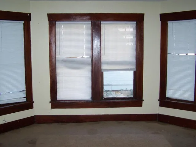 an empty room with window