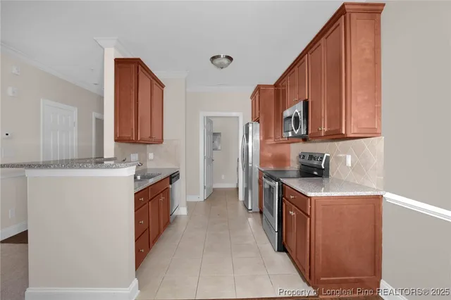 a kitchen with a sink stove top oven and cabinets