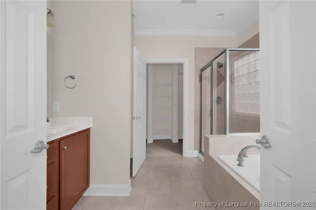 a bathroom with a tub shower and sink