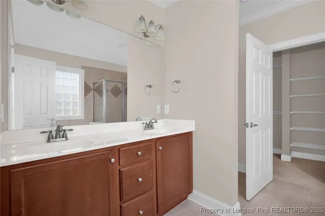 a bathroom with a double vanity sink and mirror