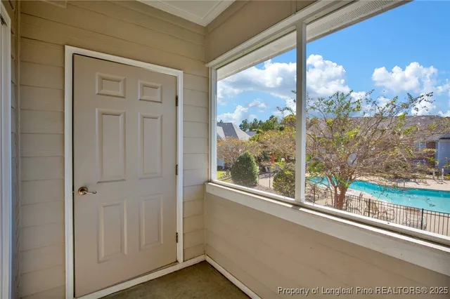 a view of a room with a large window