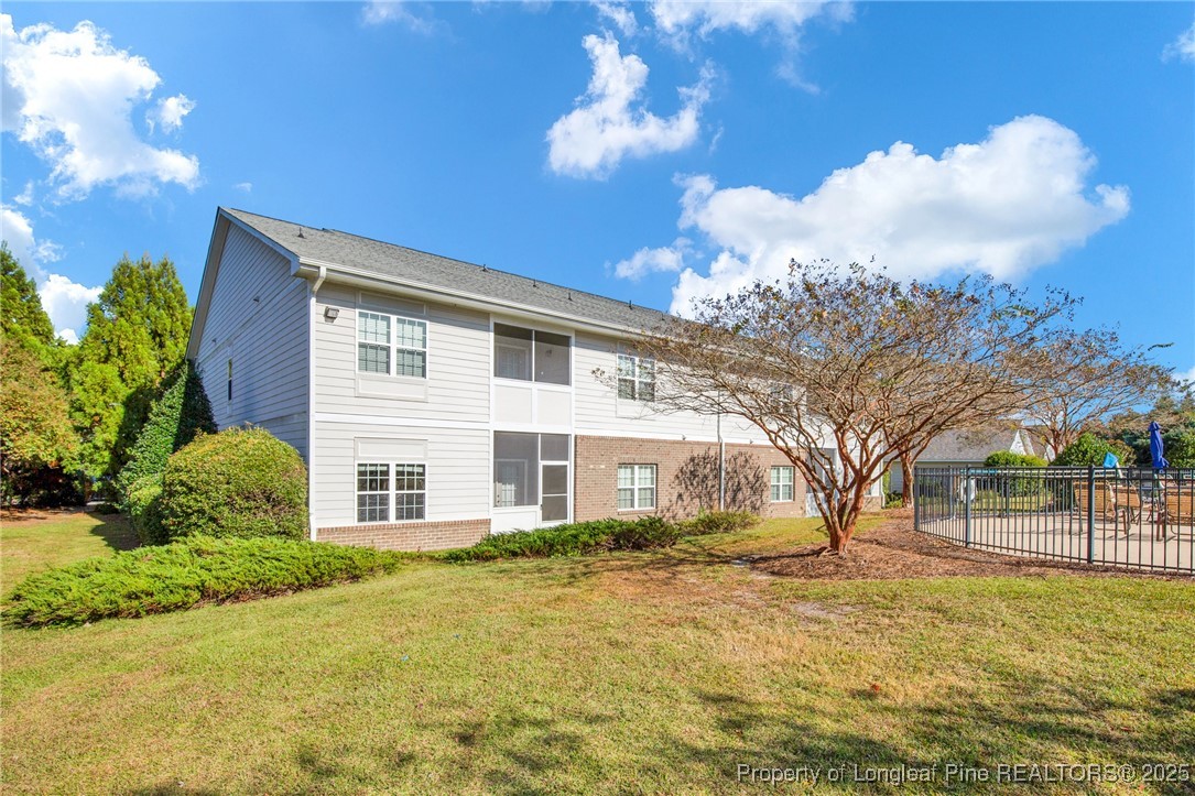 321 Gallery Drive, Unit 202 Spring Lake, NC 28390 - Photo 34 of 40 a view of a house with backyard and tree