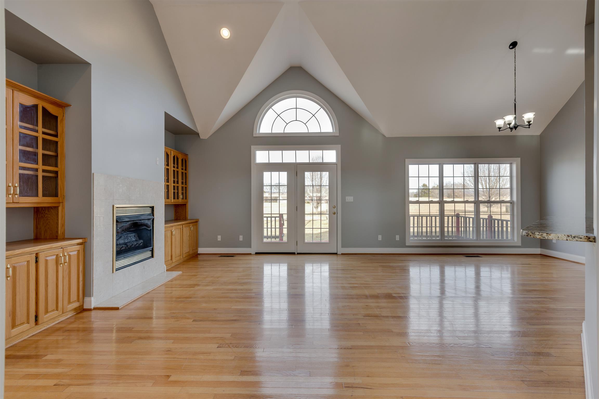 75 Keith Cove Road Cowan, TN 37318 - Photo 6 of 30 Great room has vaulted ceilings, built in book cases, and fireplace