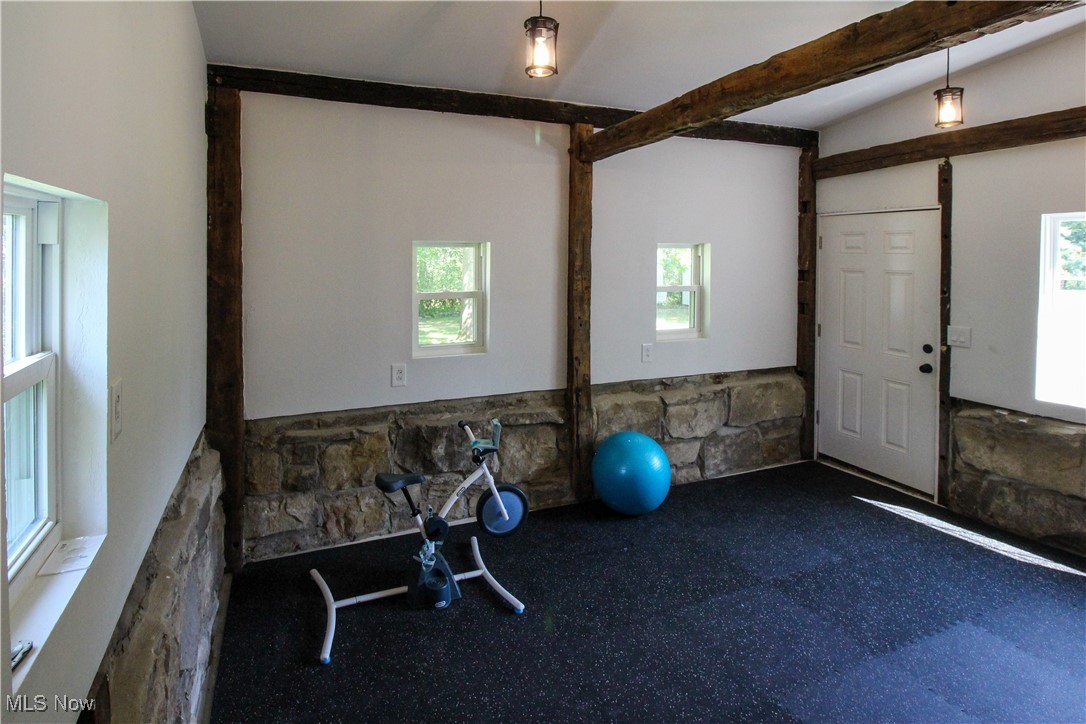 207 Harmon Road Aurora, OH 44202 - Photo 33 of 40 Workout area or workshop featuring lofted ceiling and plenty of natural light.