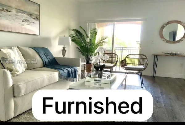a view of living room with furniture and window