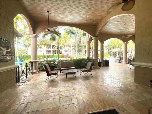 a lobby with furniture and a large window