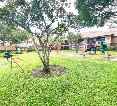a view of park with swings and slides