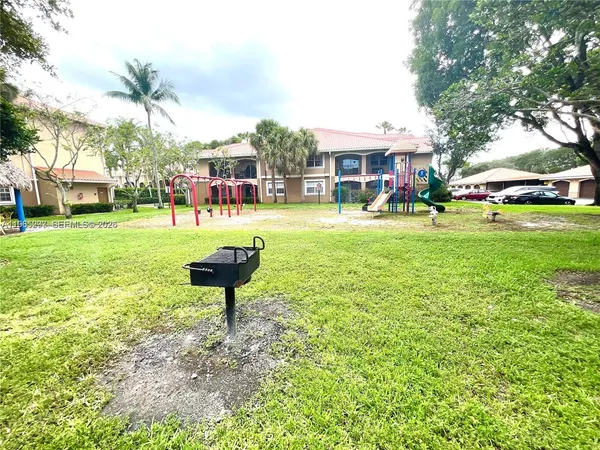 a front view of a house with a yard table and chairs