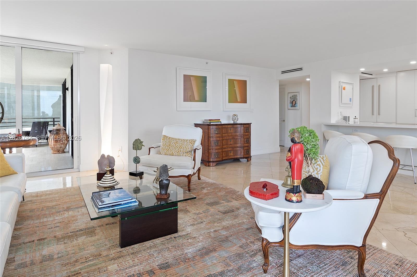151 Southeast 15th Road, Unit 601 Miami, FL 33129 - Photo 4 of 36 a living room with furniture and wooden floor