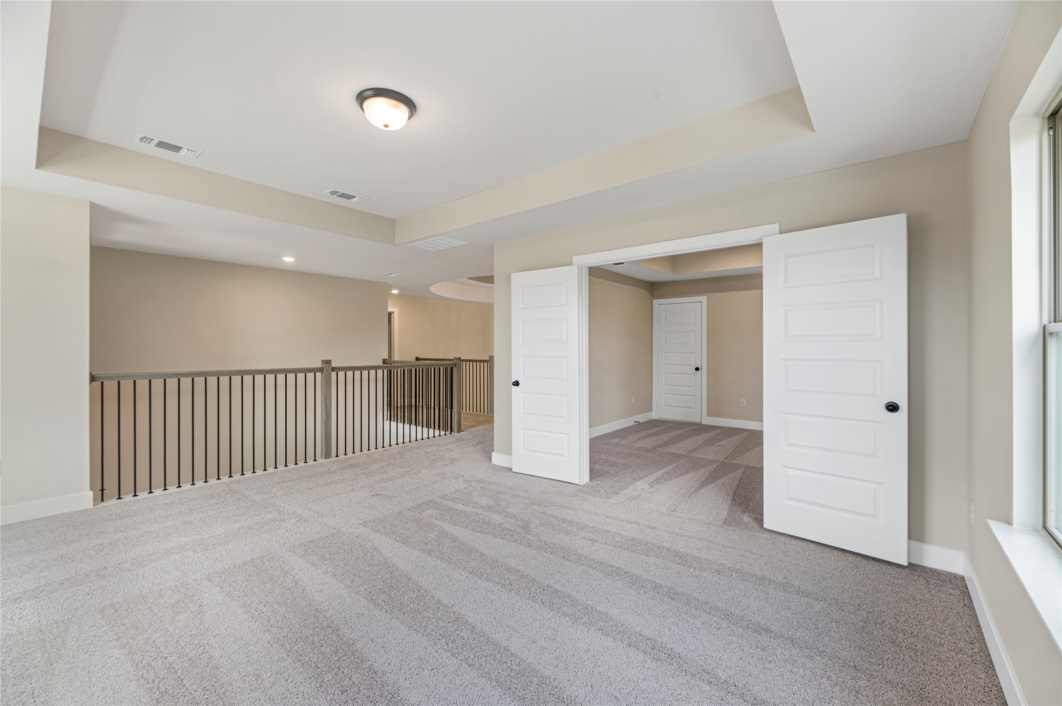 1508 Rodeo Ridge Drive Georgetown, TX 78628 - Photo 18 of 37 Carpeted spare room featuring a tray ceiling and baseboards