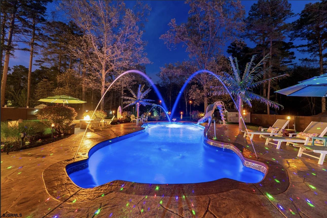 344 Old New York Road Port Republic, NJ 08241 - Photo 12 of 99 a view of a swimming pool with an outdoor space and seating area