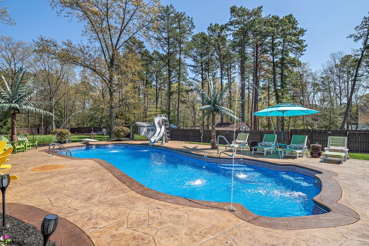 344 Old New York Road Port Republic, NJ 08241 - Photo 32 of 99 a view of a swimming pool with an outdoor space and seating area