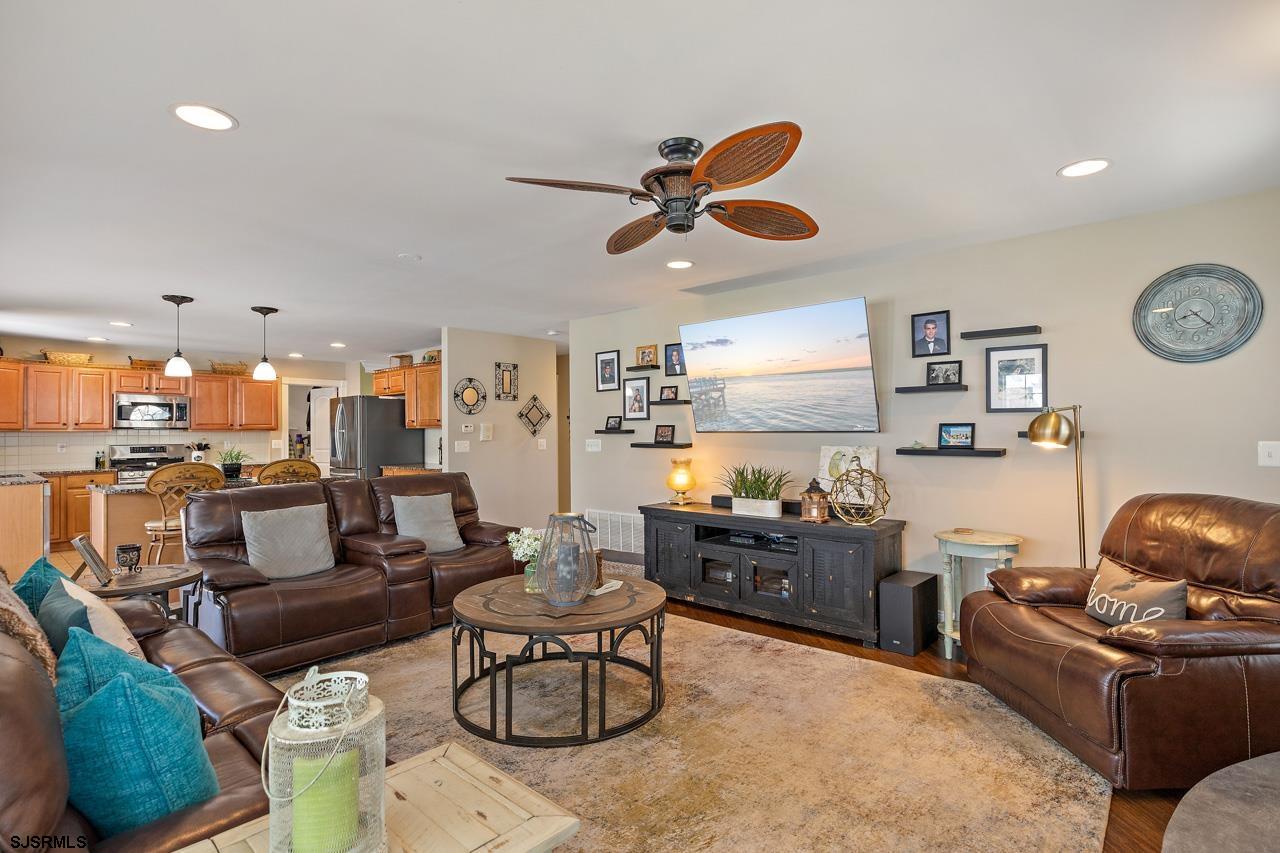 344 Old New York Road Port Republic, NJ 08241 - Photo 52 of 99 a living room with furniture kitchen view and a chandelier