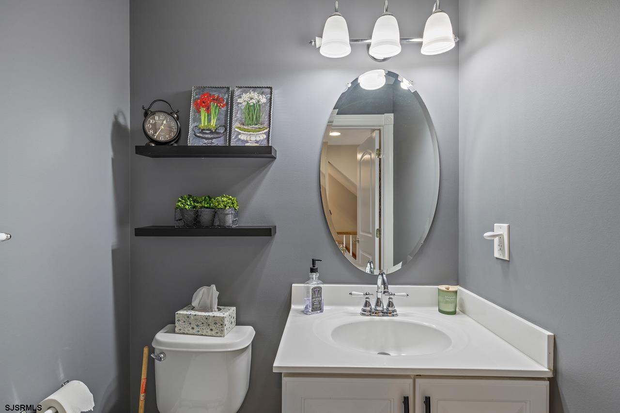 344 Old New York Road Port Republic, NJ 08241 - Photo 64 of 99 a bathroom with a toilet sink and mirror