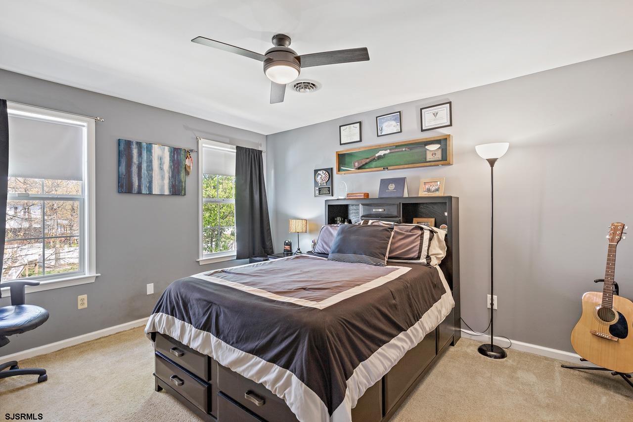 344 Old New York Road Port Republic, NJ 08241 - Photo 76 of 99 a bedroom with a bed a window and chair