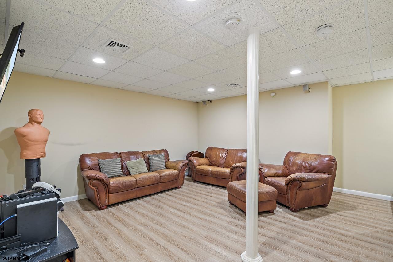 344 Old New York Road Port Republic, NJ 08241 - Photo 78 of 99 a living room with furniture a couch and a potted plant