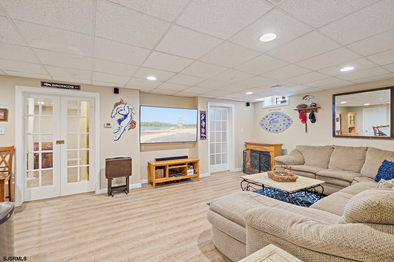 344 Old New York Road Port Republic, NJ 08241 - Photo 80 of 99 a living room with furniture and a flat screen tv