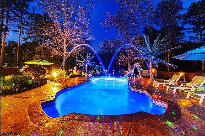 344 Old New York Road Port Republic, NJ 08241 - Photo 9 of 99 a view of a swimming pool with an outdoor space and seating area