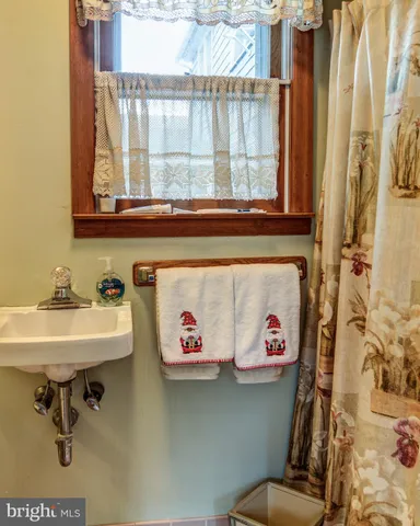 a bathroom with a sink and a window