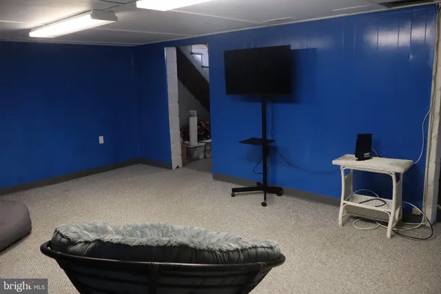 a room with furniture and a flat screen tv