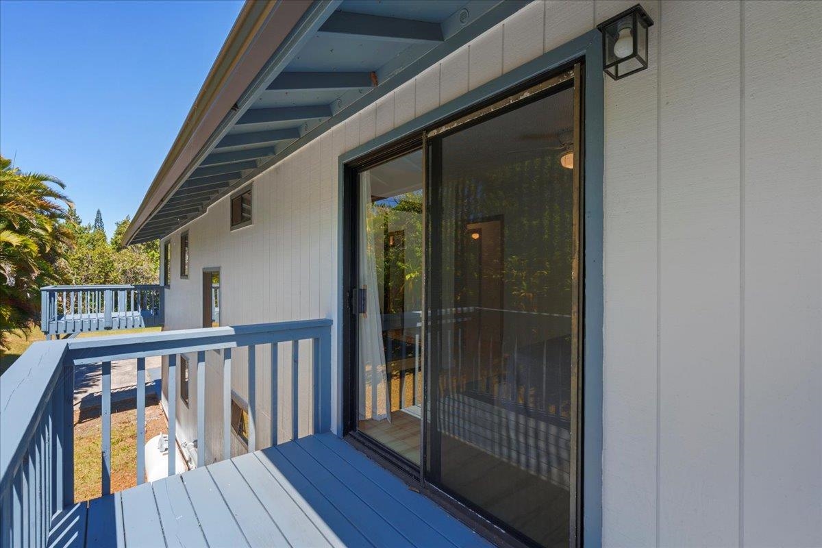 2130 Kauhikoa Road, Unit A Haiku, HI 96708 - Photo 37 of 43 a view of balcony with wooden floor