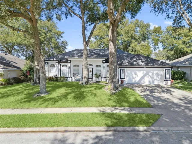 a view of a house with a yard