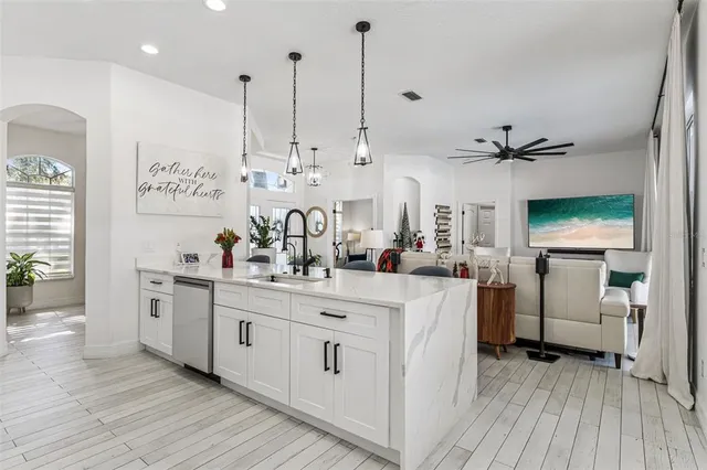 a bathroom with double vanity sink a mirror a vanity and window