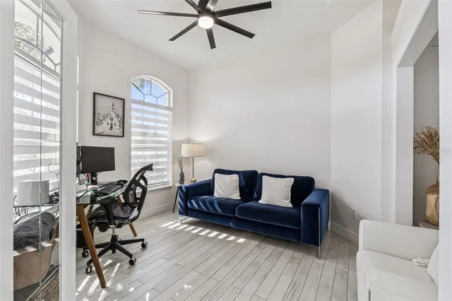 a bedroom with a bed and a chair