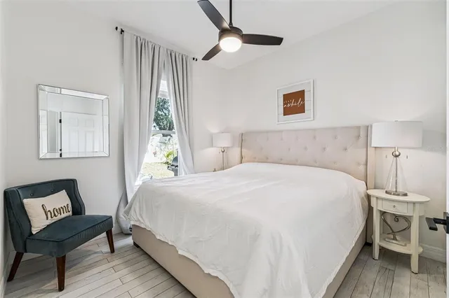 a bedroom with a bed and a chair