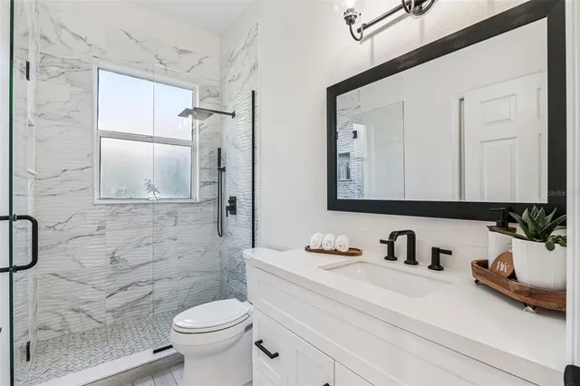 a living room with a table and chairs