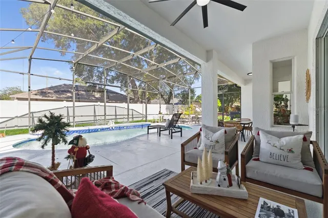 a view of a swimming pool with a lounge chairs