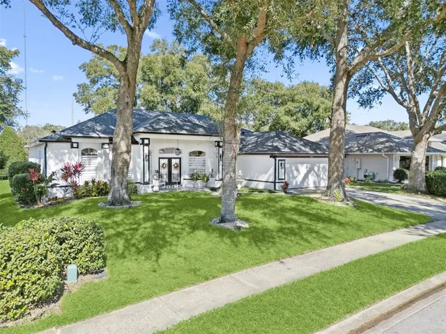 a view of a house with a yard porch and sitting area