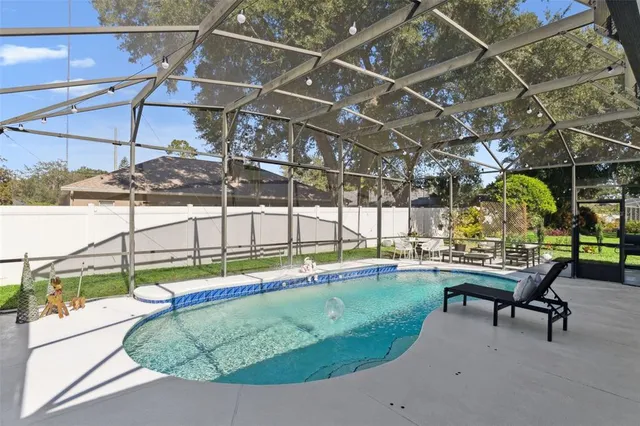 a view of a swimming pool with a patio