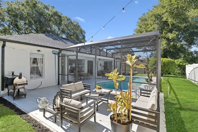 a view of backyard with patio