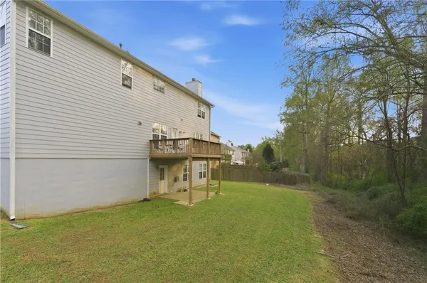a view of an empty room and wooden floor