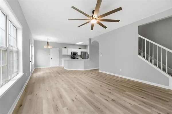a view of a dining room with furniture wooden floor and chandelier