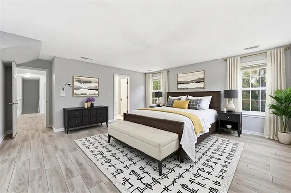 an aerial view of a house with swimming pool and large trees