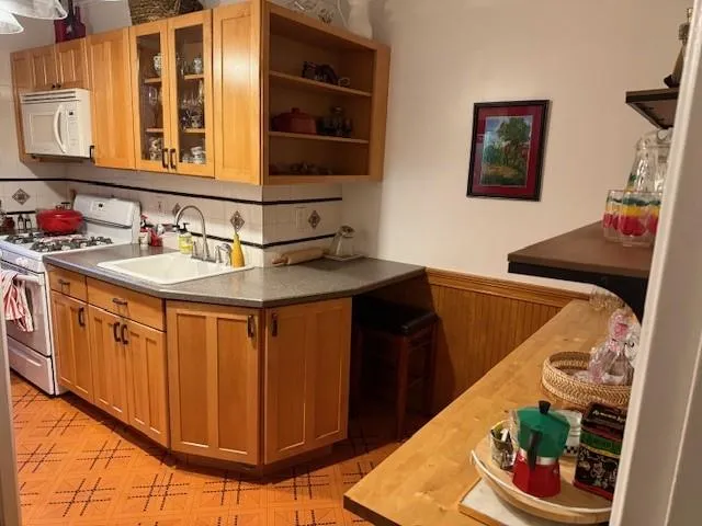 a kitchen with a sink and a stove
