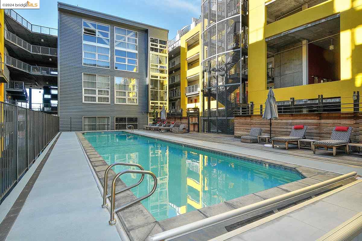 311 Oak Street, Unit 540 Oakland, CA 94607 - Photo 18 of 21 a view of a swimming pool with a lounge chairs