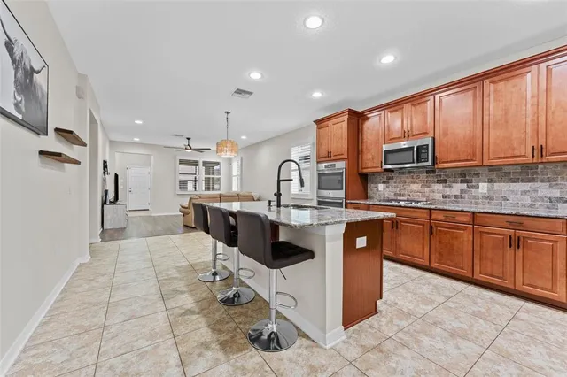 a kitchen with a stove and a sink