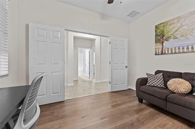 a kitchen with stainless steel appliances granite countertop a stove top oven a sink a refrigerator and a granite counter tops