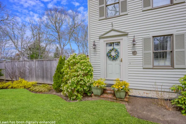 a front view of a house with garden
