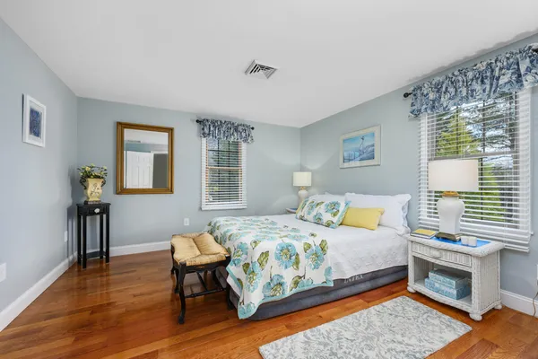 a bedroom with a bed and a desk