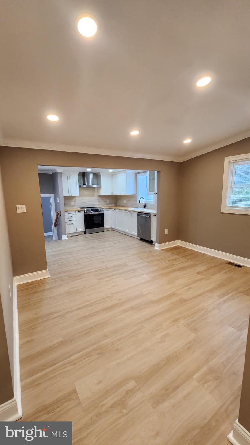 1407 Sunken Road Fredericksburg, VA 22401 - Photo 11 of 39 a view of an empty room with kitchen and a window