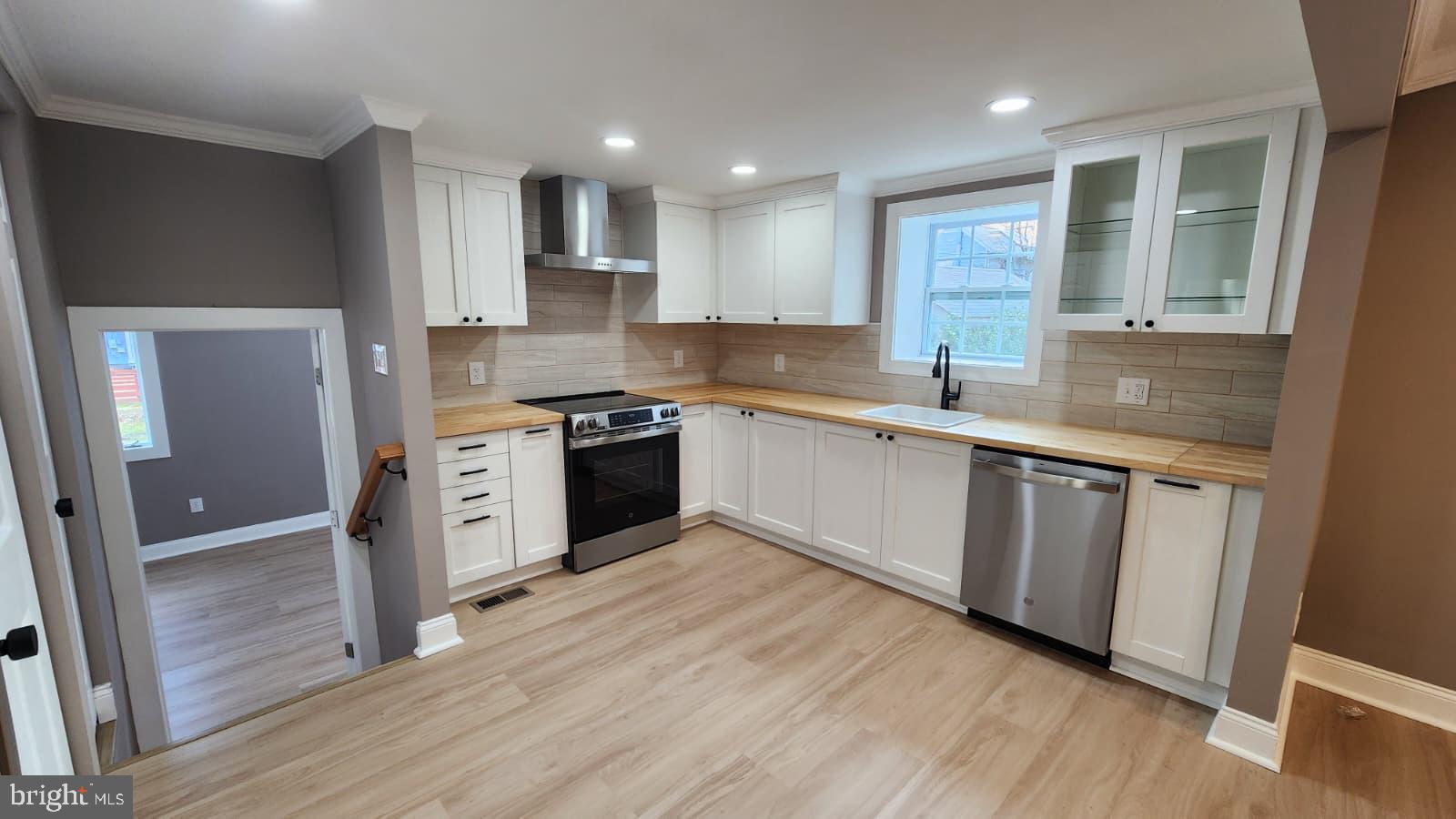 1407 Sunken Road Fredericksburg, VA 22401 - Photo 14 of 39 a kitchen with stainless steel appliances granite countertop wooden cabinets a sink a stove a refrigerator and island